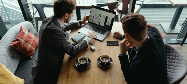 A business man looking at pension advice services online